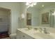 Bright bathroom features a double vanity, toilet, and closet for ample storage at 204 Michigan Ave # C-5 - 11, Folly Beach, SC 29439