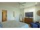Comfortable bedroom with a large TV, lots of natural light, and calming colors at 204 Michigan Ave # C-5 - 11, Folly Beach, SC 29439