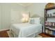 Cozy bedroom features a full bed, bookshelf and calming light-colored walls at 204 Michigan Ave # C-5 - 11, Folly Beach, SC 29439