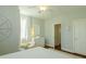 Bright bedroom features a comfy chair, dresser, and view into a connected space at 204 Michigan Ave # C-5 - 11, Folly Beach, SC 29439
