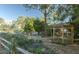 A wooden gazebo is nestled in lush landscaping with a garden and water feature at 204 Michigan Ave # C-5 - 11, Folly Beach, SC 29439