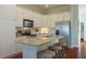 Modern kitchen featuring stainless steel appliances, granite countertops, and ample cabinet space at 204 Michigan Ave # C-5 - 11, Folly Beach, SC 29439