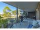Relaxing outdoor patio with grill, seating, and views of the community at 204 Michigan Ave # C-5 - 11, Folly Beach, SC 29439
