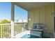 Inviting porch with a stylish bench, a table, and tranquil neighborhood vistas at 204 Michigan Ave # C-5 - 11, Folly Beach, SC 29439