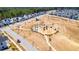 Aerial view of the community showcasing the layout of neighborhood streets, playgrounds, and community green spaces at 205 Somerset Acres Dr, Summerville, SC 29486