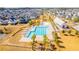 Aerial view of a community pool with pergola, surrounding homes, and walking path at 205 Somerset Acres Dr, Summerville, SC 29486