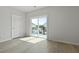 Well-lit bedroom with door to balcony and light hardwood floors at 205 Somerset Acres Dr, Summerville, SC 29486