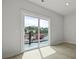Well-lit bedroom with door to balcony and light hardwood floors at 205 Somerset Acres Dr, Summerville, SC 29486