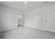 This bedroom has plush carpet, neutral walls, and a bright white door, creating a calming and inviting space at 205 Somerset Acres Dr, Summerville, SC 29486