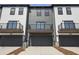 Stunning exterior of townhomes featuring covered balcony and convenient garage access; modern living at 205 Somerset Acres Dr, Summerville, SC 29486