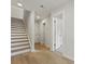 Bright entryway with hardwood floors and staircase leading to upper level at 205 Somerset Acres Dr, Summerville, SC 29486