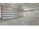 Spacious unfinished garage with concrete floor, and unfinished drywall for a customizable space at 205 Somerset Acres Dr, Summerville, SC 29486