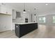 Modern kitchen with large center island, pendant lighting and stainless appliances at 205 Somerset Acres Dr, Summerville, SC 29486