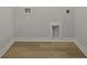 Empty laundry area with hookups and wood flooring. The space awaits a washer and dryer ready to be installed at 205 Somerset Acres Dr, Summerville, SC 29486