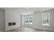 Living room featuring a fireplace and windows with a view of greenery at 205 Somerset Acres Dr, Summerville, SC 29486