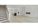 Open concept living room with hardwood floors, fireplace, and kitchen at 205 Somerset Acres Dr, Summerville, SC 29486