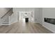 Open concept living room with hardwood floors, fireplace, and kitchen at 205 Somerset Acres Dr, Summerville, SC 29486
