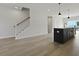 Open-concept living space with a kitchen island and hardwood flooring at 205 Somerset Acres Dr, Summerville, SC 29486