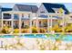 Modern community pool and lounge area with stylish pergola and lush landscaping at 205 Somerset Acres Dr, Summerville, SC 29486