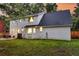 Spacious backyard with a patio area, lush lawn, and mature trees at 205 Towhee Dr, Summerville, SC 29485