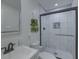 Modern bathroom featuring tiled shower with glass door, updated vanity, and contemporary fixtures at 205 Towhee Dr, Summerville, SC 29485