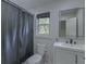Well-lit bathroom featuring a vanity, toilet, updated fixtures and a window offering natural light at 205 Towhee Dr, Summerville, SC 29485