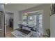 Charming dining area with a wooden table and bench seating, bathed in natural light from a large bay window at 205 Towhee Dr, Summerville, SC 29485
