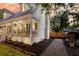 Charming home with a covered porch, professional landscaping, and a cozy outdoor seating area at 205 Towhee Dr, Summerville, SC 29485