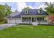 Beautiful home with a well-manicured lawn, a covered porch, and classic curb appeal at 205 Towhee Dr, Summerville, SC 29485