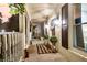 Inviting front porch with decorative lanterns, plants and a neutral welcome mat creating a cozy entrance at 205 Towhee Dr, Summerville, SC 29485
