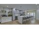 Modern kitchen featuring an island with barstool seating, stainless steel appliances, and sleek countertops at 205 Towhee Dr, Summerville, SC 29485