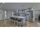 Spacious kitchen features a large island with seating and modern stainless steel appliances under recessed lighting at 205 Towhee Dr, Summerville, SC 29485