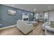 Modern living room boasts stylish accents, a fireplace, and recessed lighting for a cozy yet modern ambiance at 205 Towhee Dr, Summerville, SC 29485