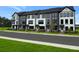 New townhomes boast modern design with gray and white exteriors, and professional landscaping at 209 Somerset Acres Dr, Summerville, SC 29486
