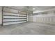 Spacious garage with an automatic overhead door and concrete flooring at 209 Somerset Acres Dr, Summerville, SC 29486