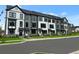 New townhomes with modern exteriors, neat landscaping, and paved street at 209 Somerset Acres Dr, Summerville, SC 29486