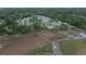 Aerial view of a neighborhood near a waterway, featuring docks, marshland, and residential homes at 2408 Bent Oak Rd, Mount Pleasant, SC 29466