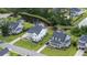 Aerial view of homes near a pond showcasing well-manicured lawns and inviting curb appeal at 2408 Bent Oak Rd, Mount Pleasant, SC 29466