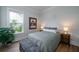 Cozy bedroom featuring a comfortable bed, stylish decor, and natural light from a window at 2408 Bent Oak Rd, Mount Pleasant, SC 29466