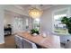Formal dining room featuring a coffered ceiling, hardwood floors, and a designer light fixture at 2408 Bent Oak Rd, Mount Pleasant, SC 29466
