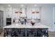 Well-equipped kitchen with an island, quartz countertops, custom cabinetry, and modern pendant lighting at 2408 Bent Oak Rd, Mount Pleasant, SC 29466