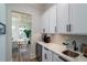 Bright kitchenette featuring white cabinets, quartz countertops, and modern appliances at 2408 Bent Oak Rd, Mount Pleasant, SC 29466
