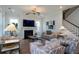 Bright and airy living room with comfortable furniture, a fireplace, and staircase access at 2408 Bent Oak Rd, Mount Pleasant, SC 29466