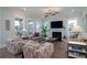 Open-concept living room featuring stylish furnishings, a fireplace, and large windows at 2408 Bent Oak Rd, Mount Pleasant, SC 29466
