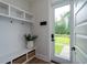 Mud room featuring built-in storage, a bench, and access to the outdoors at 2408 Bent Oak Rd, Mount Pleasant, SC 29466