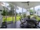 Enclosed porch featuring comfortable seating, a ceiling fan, and a view of the backyard at 2408 Bent Oak Rd, Mount Pleasant, SC 29466