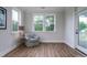 Sitting area features hardwood floors, a comfy chair, and lots of natural light at 2408 Bent Oak Rd, Mount Pleasant, SC 29466