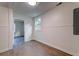 Basement room showcasing laminate flooring, a window, and stylish paneling at 2657 Oregon Ave, North Charleston, SC 29405