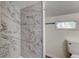 Modern bathroom features luxurious marble-tiled shower and updated fixtures at 2657 Oregon Ave, North Charleston, SC 29405
