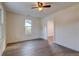 Bright bedroom with light walls, laminate flooring, and a classic ceiling fan at 2657 Oregon Ave, North Charleston, SC 29405